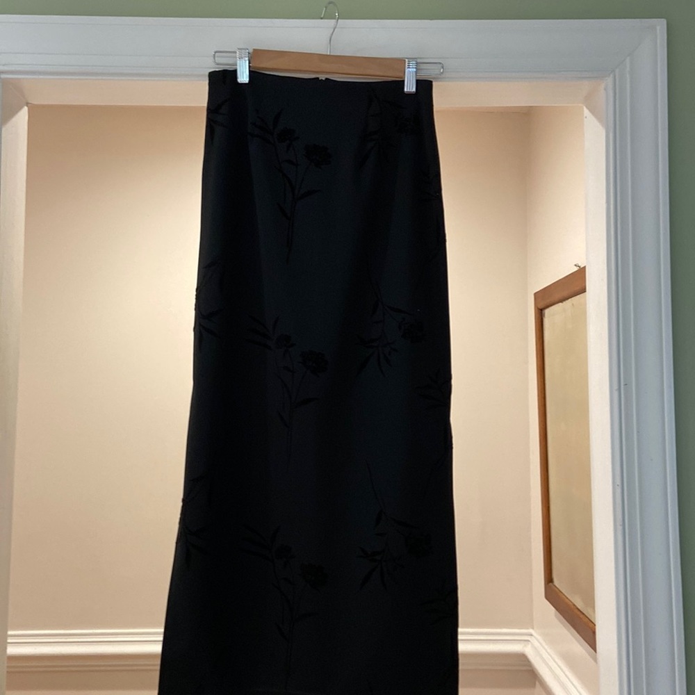 Black skirt, ankle length with split up to me no lining size 3
